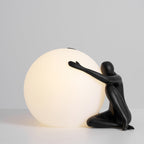 Humanoid Ball Holding Table Lamp