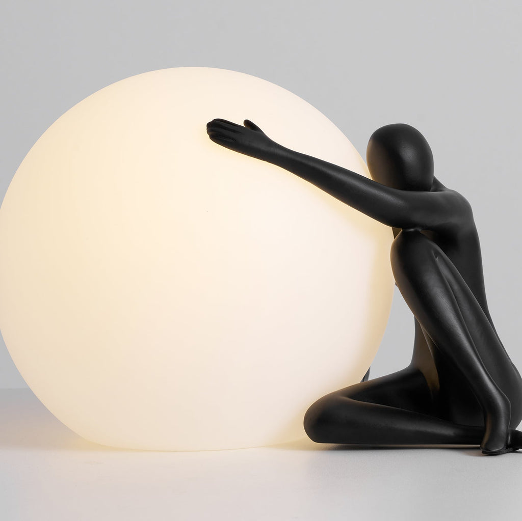 Humanoid Ball Holding Table Lamp
