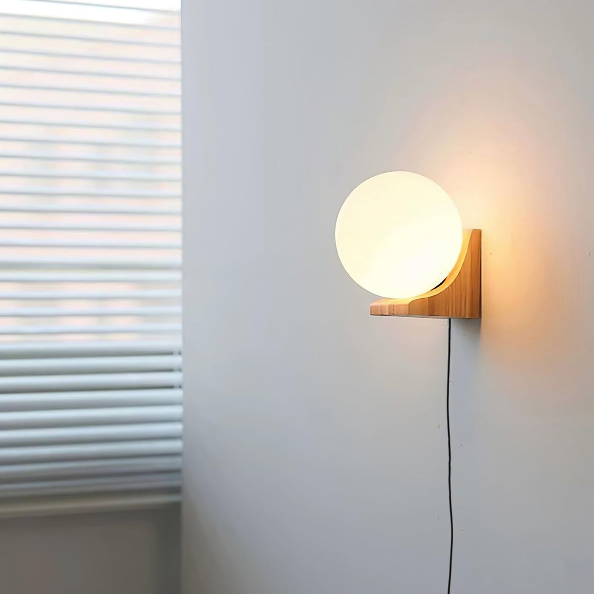 Evelyn Orb Plug - in Wall Lamp
